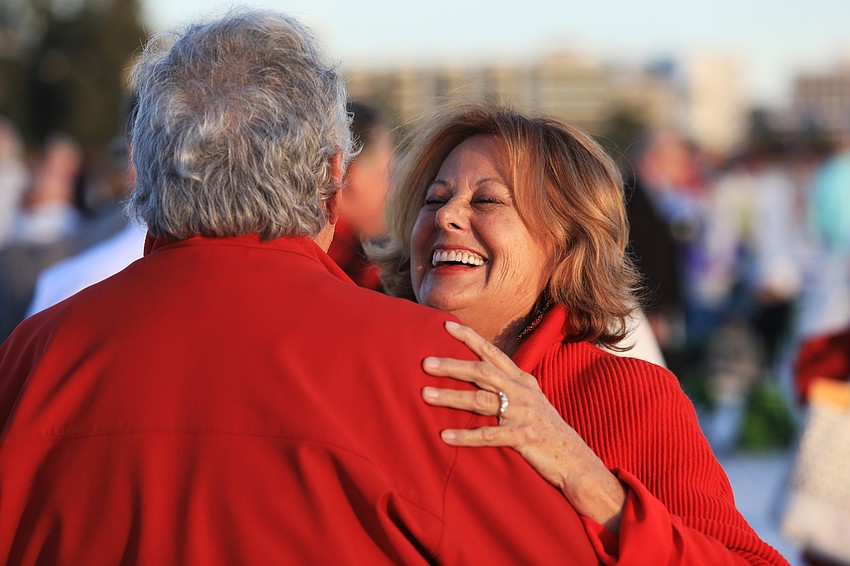 John and Roberta Montelione dance on the sand.