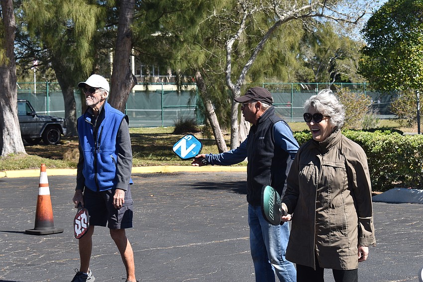 Ken Loy, Jerry East and Cheryl Keys prepare to play.
