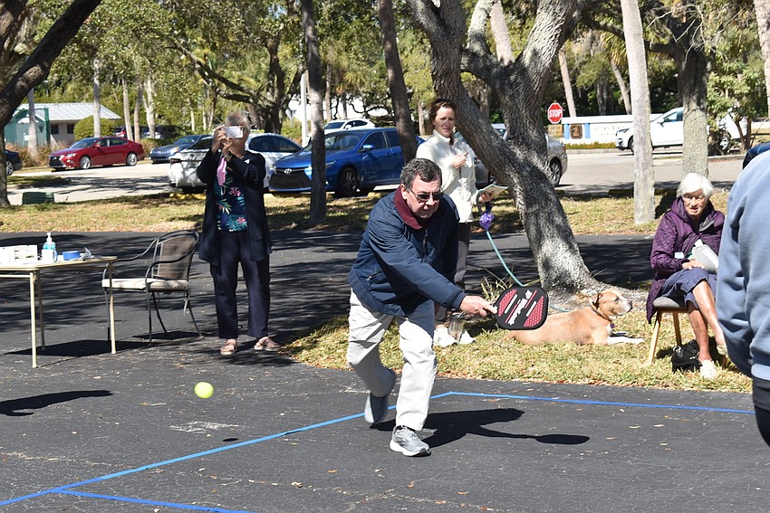 Ron Ginsberg swings for the ball.