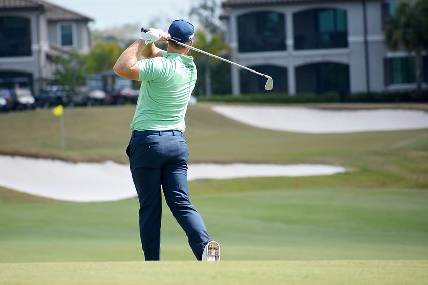 Tom Lewis hits his second shot on the No. 9 hole at Lakewood National Golf Club during the first round of the 2022 LECOM Suncoast Classic. Lewis finished one over par.