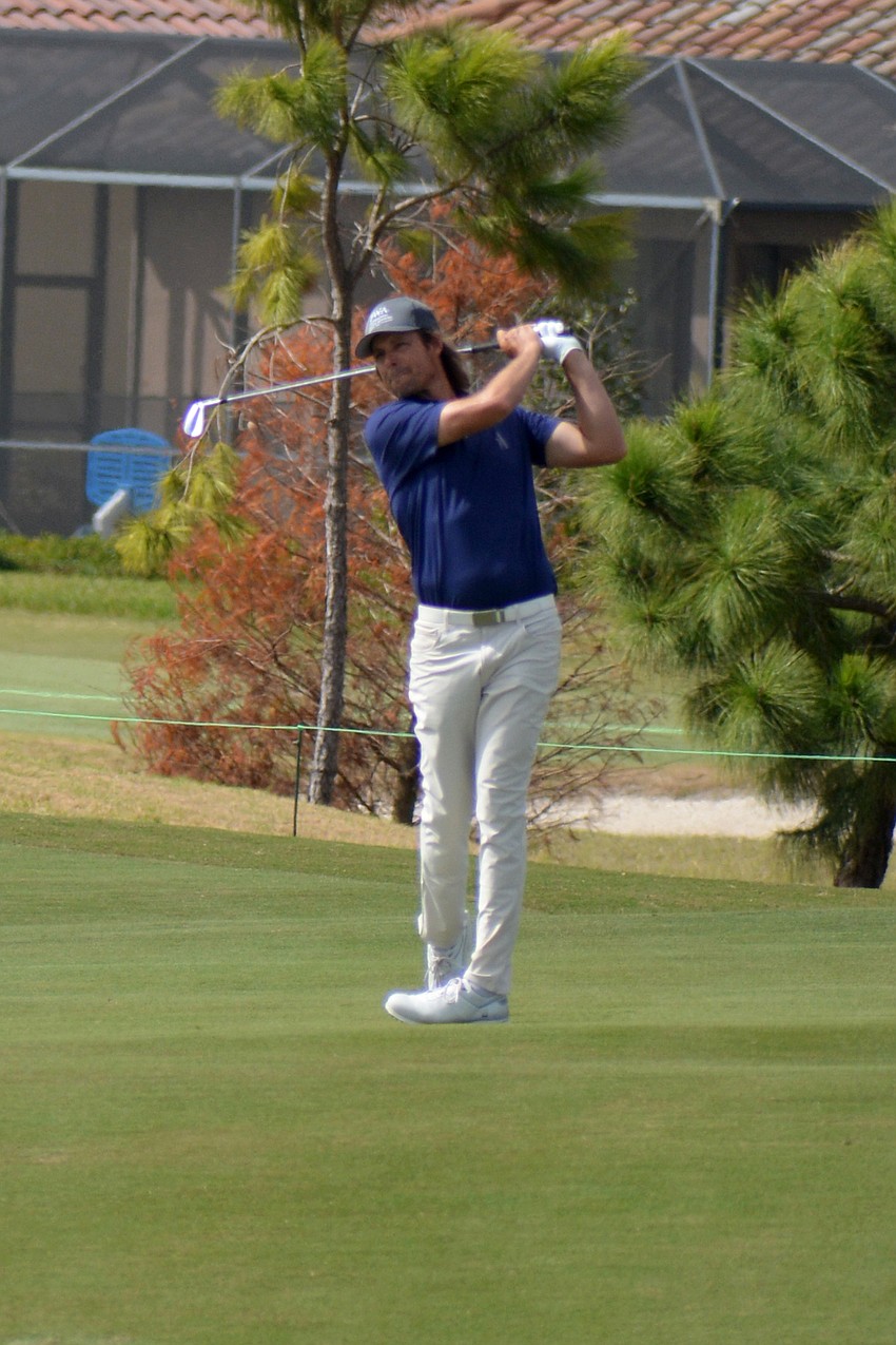 Aaron Baddeley hits his second shot on the No. 9 hole at Lakewood National Golf Club during the first round of the 2022 LECOM Suncoast Classic. Baddeley finished six under par.