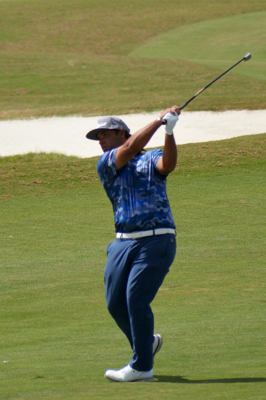 Rafael Campos hits his second shot on the No. 9 hole at Lakewood National Golf Club during the first round of the 2022 LECOM Suncoast Classic. Campos finished even par.