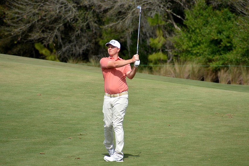 MJ Daffue hits his second shot on the No. 1 hole at Lakewood National Golf Club during the first round of the 2022 LECOM Suncoast Classic. Daffue finished three under par.