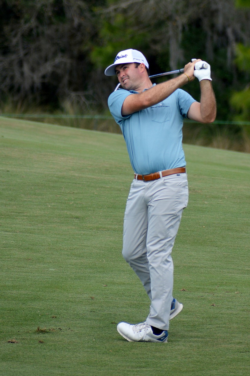 A.J. Crouch hits his second shot on the No. 1 hole at Lakewood National Golf Club during the first round of the 2022 LECOM Suncoast Classic. Crouch finished two under par.