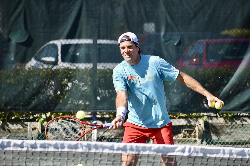 Tommy Haas returns a ground stroke from his clinic participants.