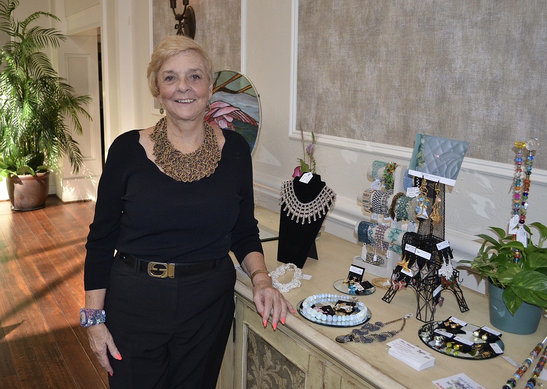 Patricia Hanly complements her display with the Swarovski crystal jewelry she is wearing.