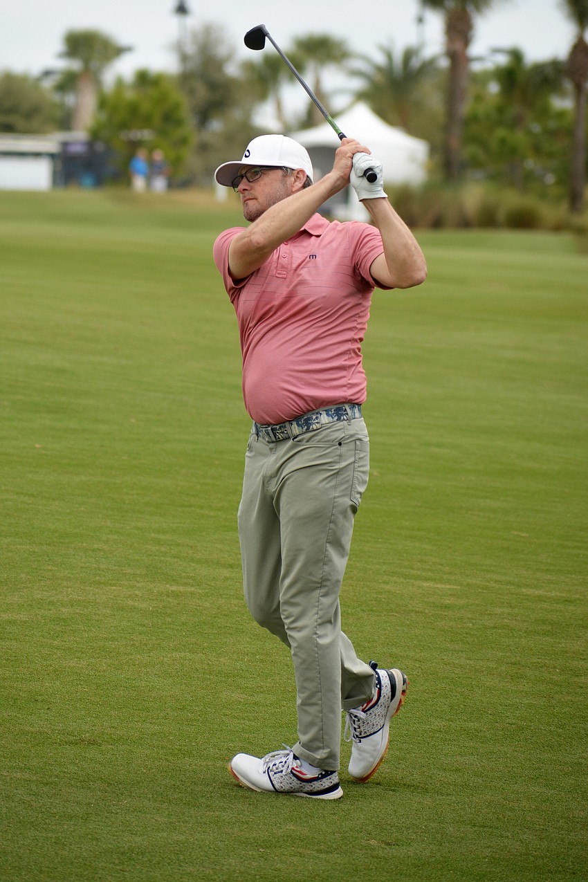 Heath Slocum hits his second shot on the No. 1 hole on the second day of the 2022 LECOM Suncoast Classic, held at Lakewood National Golf Club.