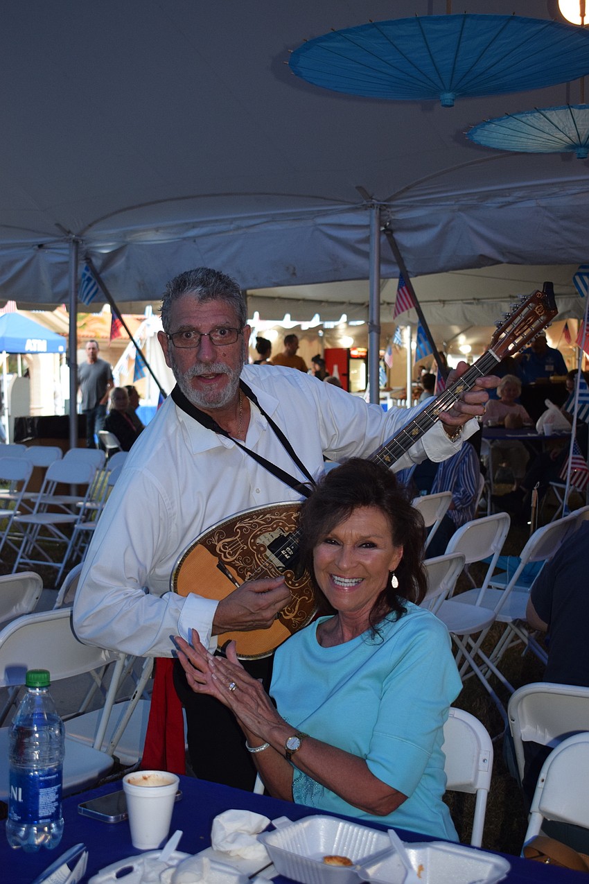 John Demas with the Omega Project plays in front of Sarasota's Suzanne Chastenay.