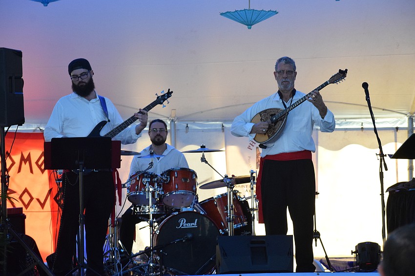 The Omega Project members Andrew Demas, Mike Passavanti and John Demas entertain the crowd with traditional Greek music.