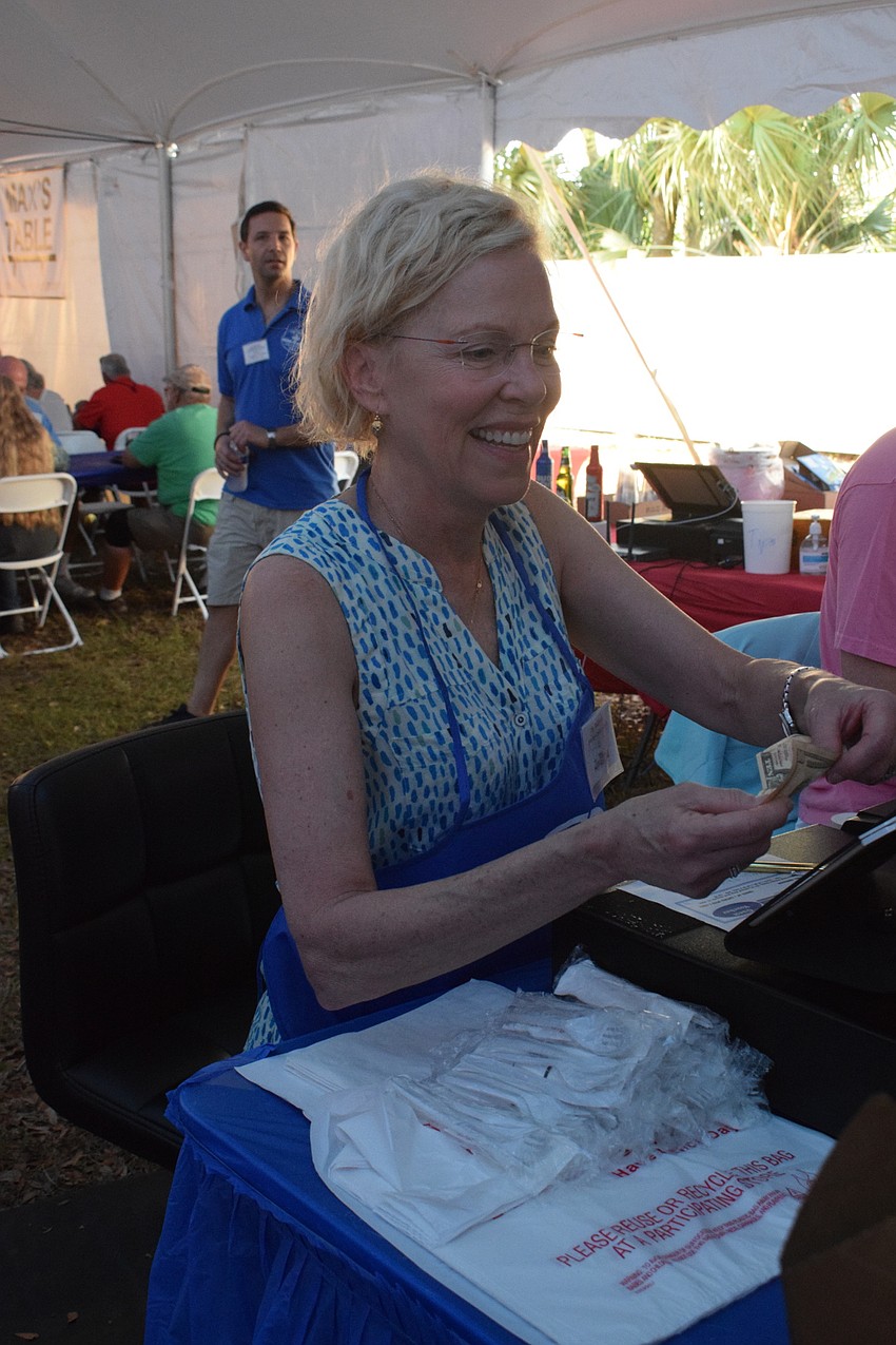 Greek Glendi volunteer Jill Harrison serves as a cashier during the Greek Glendi.