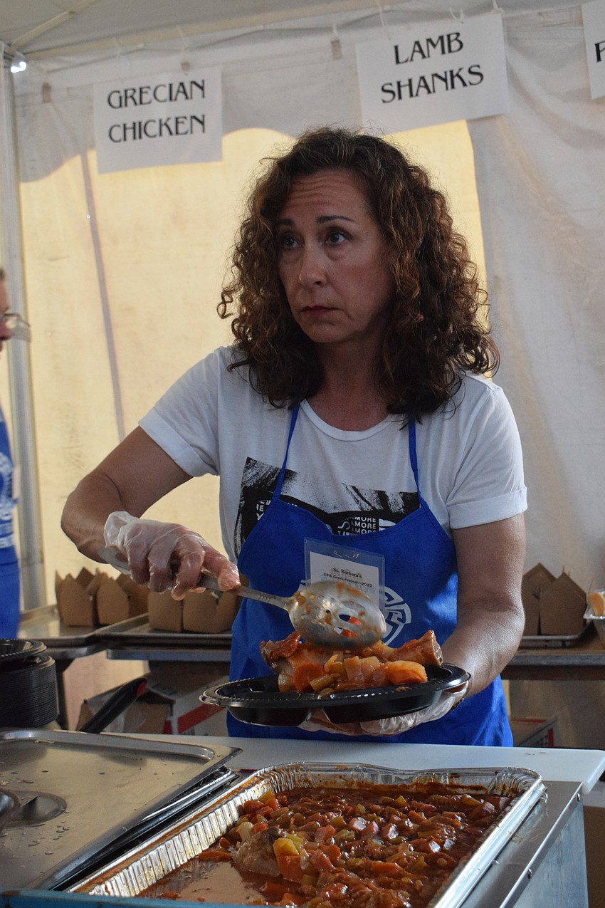 Greek Glendi volunteer Natasha Smith serves traditional Greek food.