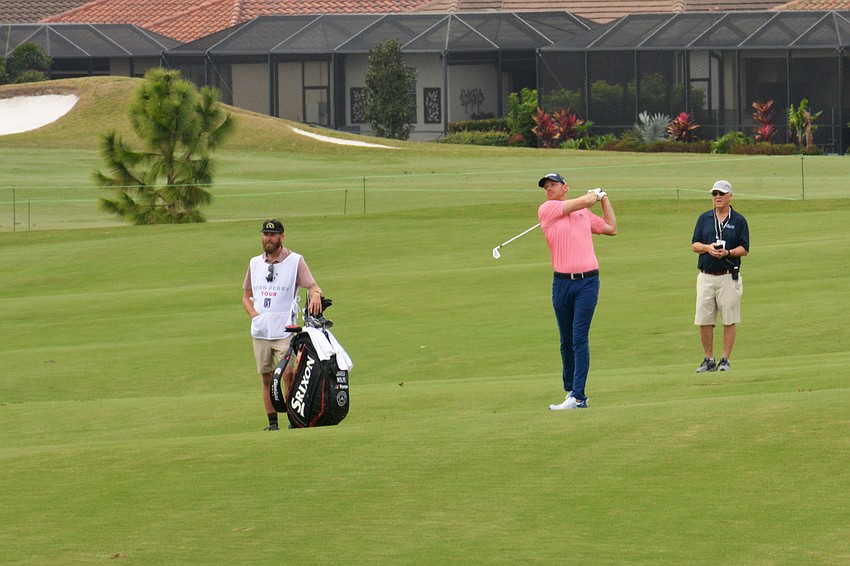 Jared Wolfe hits a shot from the fairway on the No. 9 hole during round three of the 2022 LECOM Suncoast Classic at Lakewood National Golf Club.