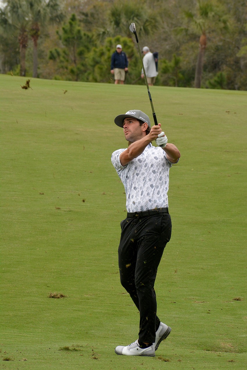 Callum Tarren sends grass flying on his second shot on the No. 1 hole during round three of the 2022 LECOM Suncoast Classic at Lakewood National Golf Club.