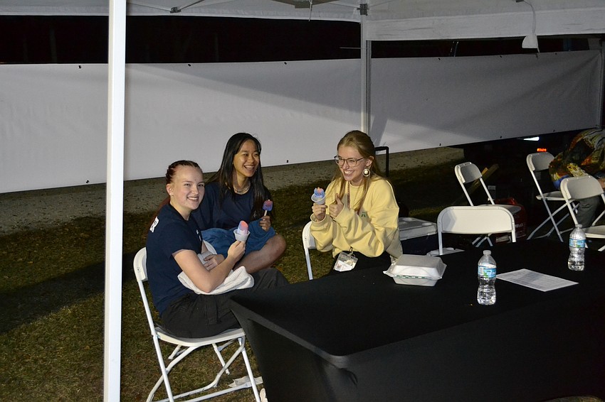 Madeline Hotaling, Nicole Chen, and Madeline Gemme bond over some frozen treats from the Pop Craft truck.