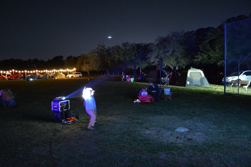 With the movie projector at the ready, it's time for the pre-show entertainment — shadow puppets.