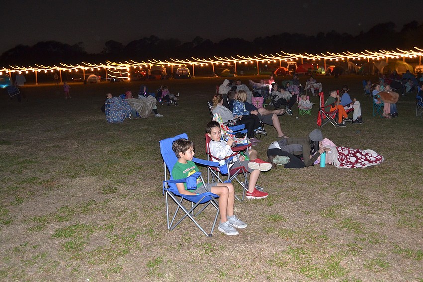 Campers young and old gather for a bedtime story — Disney's 