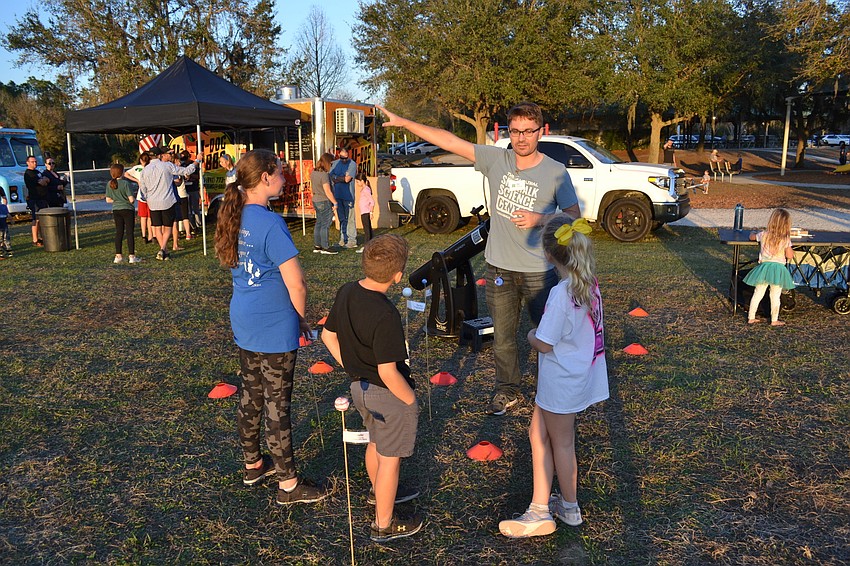 Alex Martin of Sidewalk Science Center tells kids what's up with facts about the stars and planets.