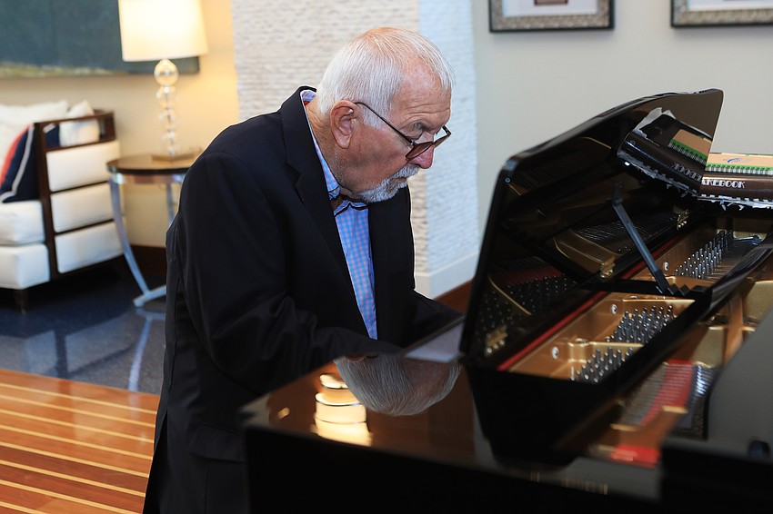Wayne Shannon plays the piano.