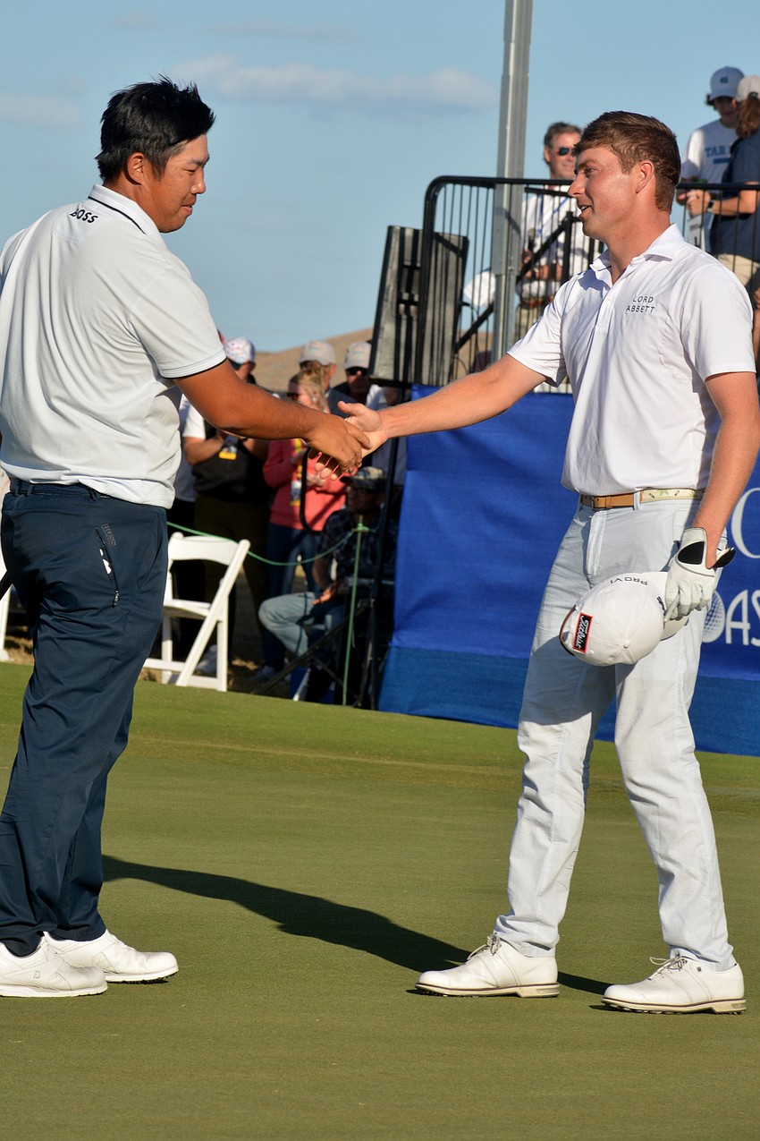 Byeong Hun An shakes hands with Ben Griffin after the final round of the 2022 LECOM Suncoast Classic at Lakewood National Golf Club. An went into the clubhouse tied for the lead; he would later be crowned champion.