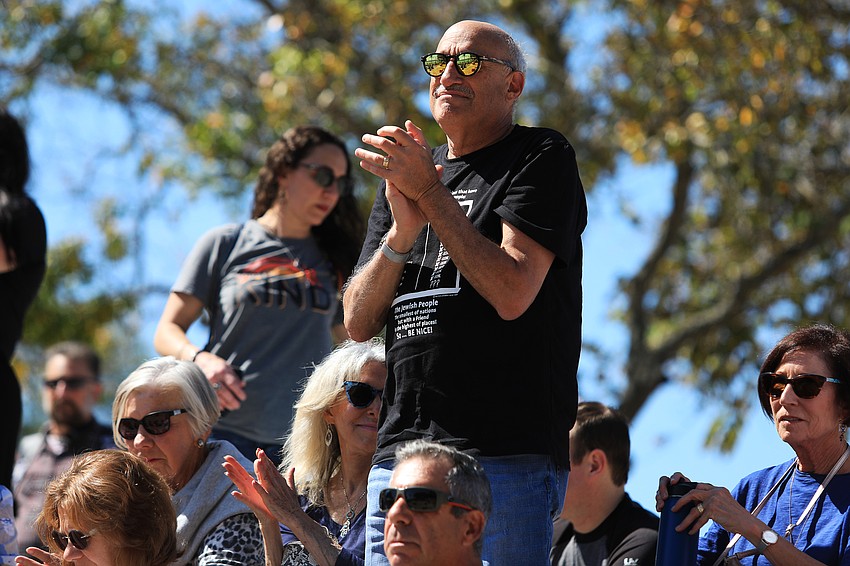Howard Tevlowitz stands and claps.