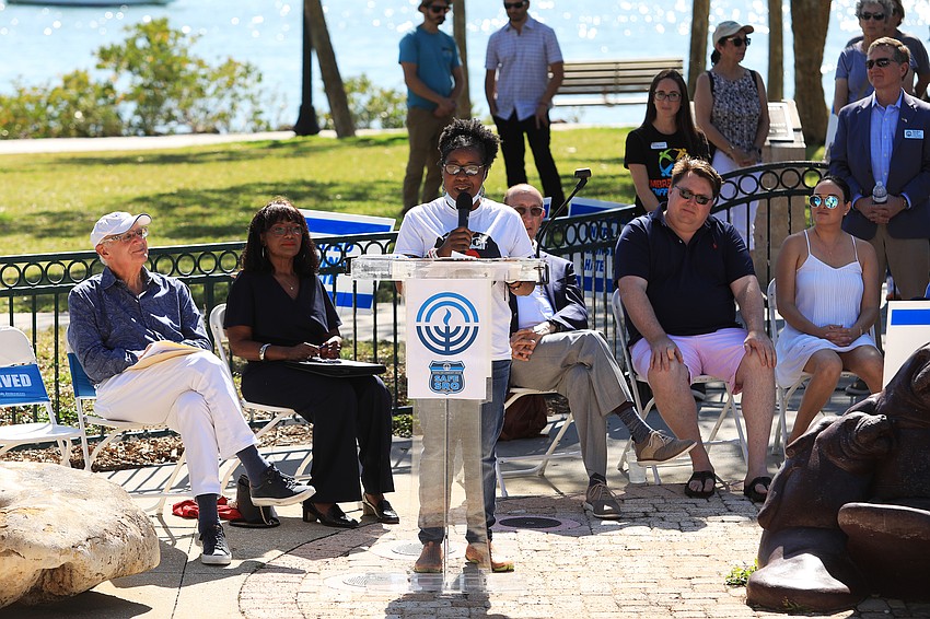 Melanie Lavender recites a poem for the crowd.