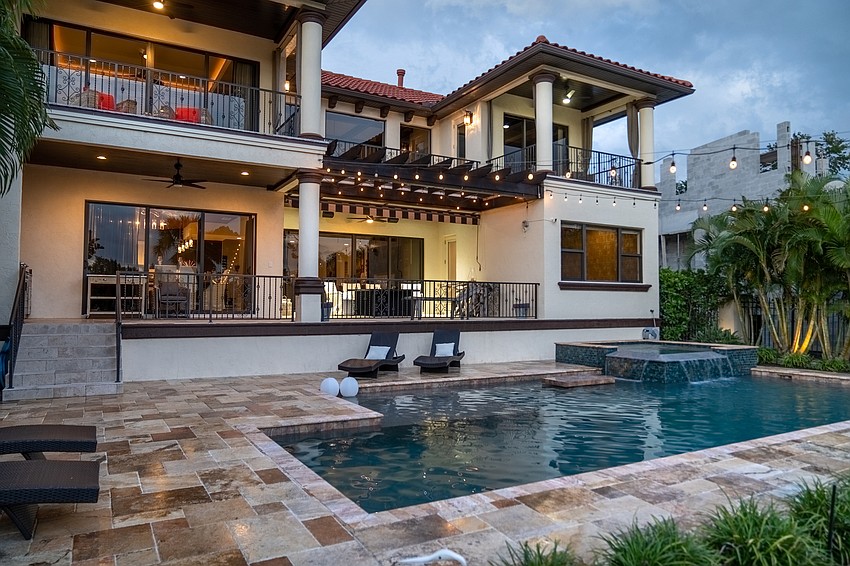 The heated pool is salt water. The outdoor living space includes a gas firepit.