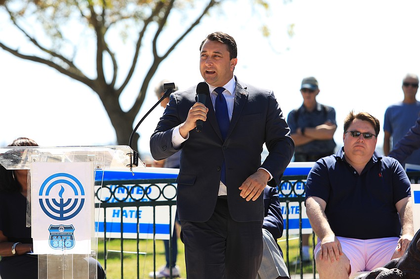 City Commissioner Hagen Brody uses a call and response method in his address.