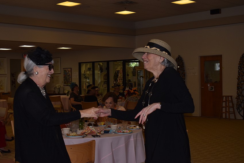 Sylvia Pastor and Nancy Cohen dance to Michael Mendez's performance.