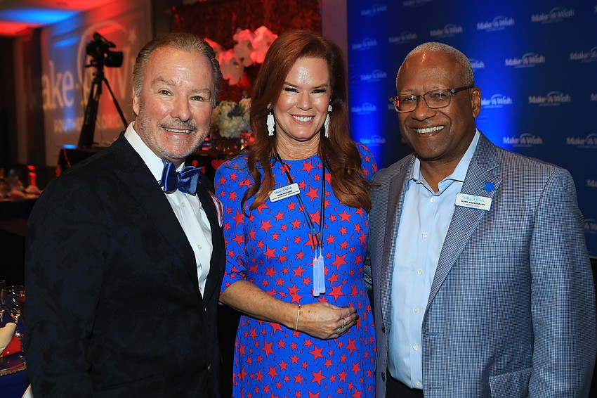 Michael and Terri Klauber with Make-A-Wish Southern Florida president and CEO Norm Wedderburn