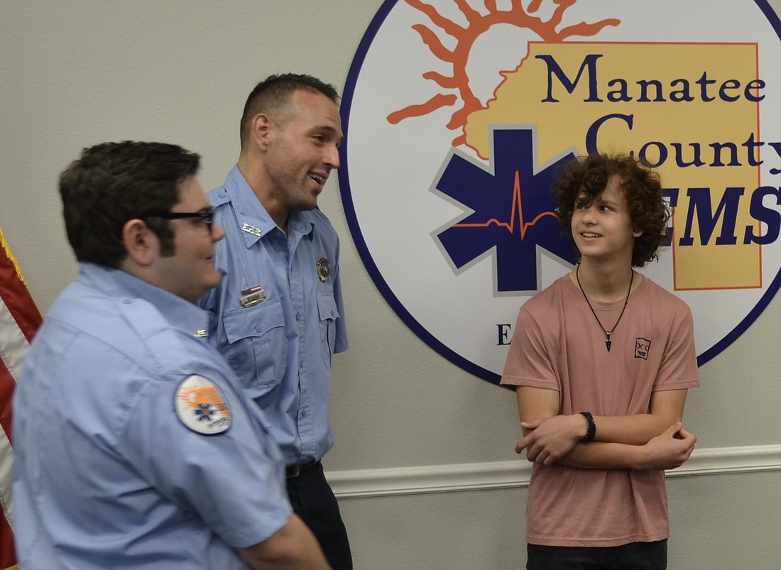 Manatee County Paramedics Nicholas Barion and Chris Roshka chat with Owen Lockaby.