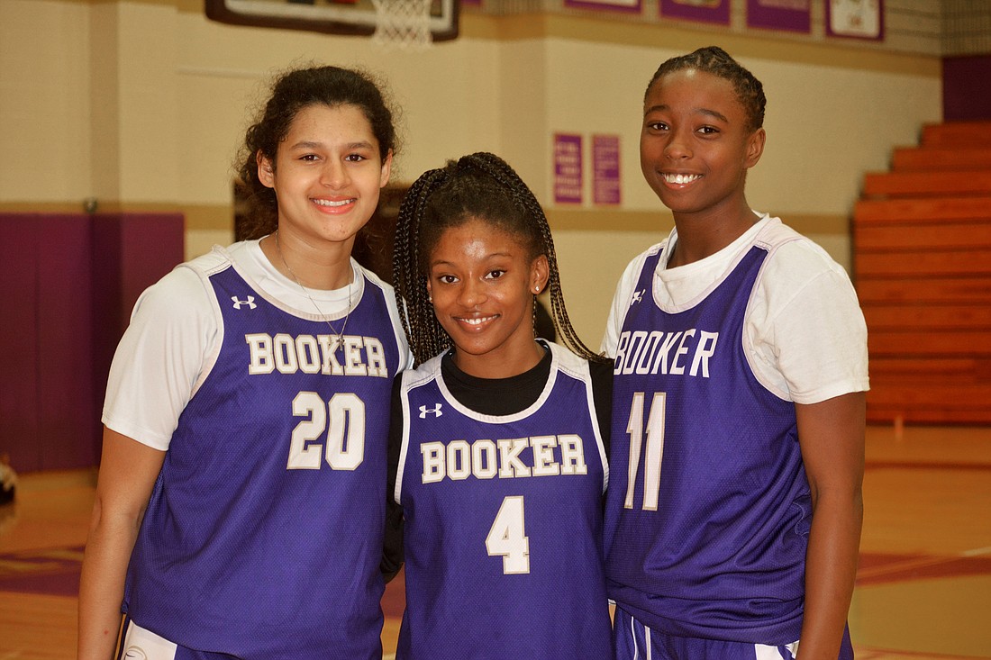 Booker senior Jaydn Lattimore, senior Ty&#39;anna Ash and junior Chariot Johnson are key contributors on the girls basketball team.