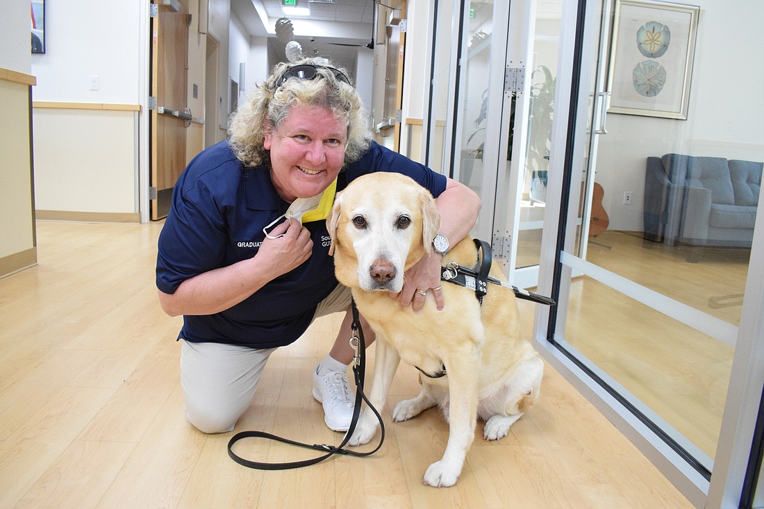 Suzy Wilford, the outreach and recruitment ambassador for Southeastern Guide Dogs, says dogs like her dog, Carson, can change someone&#39;s life. People can see how the nonprofit benefits people during the walkathon. File photo.