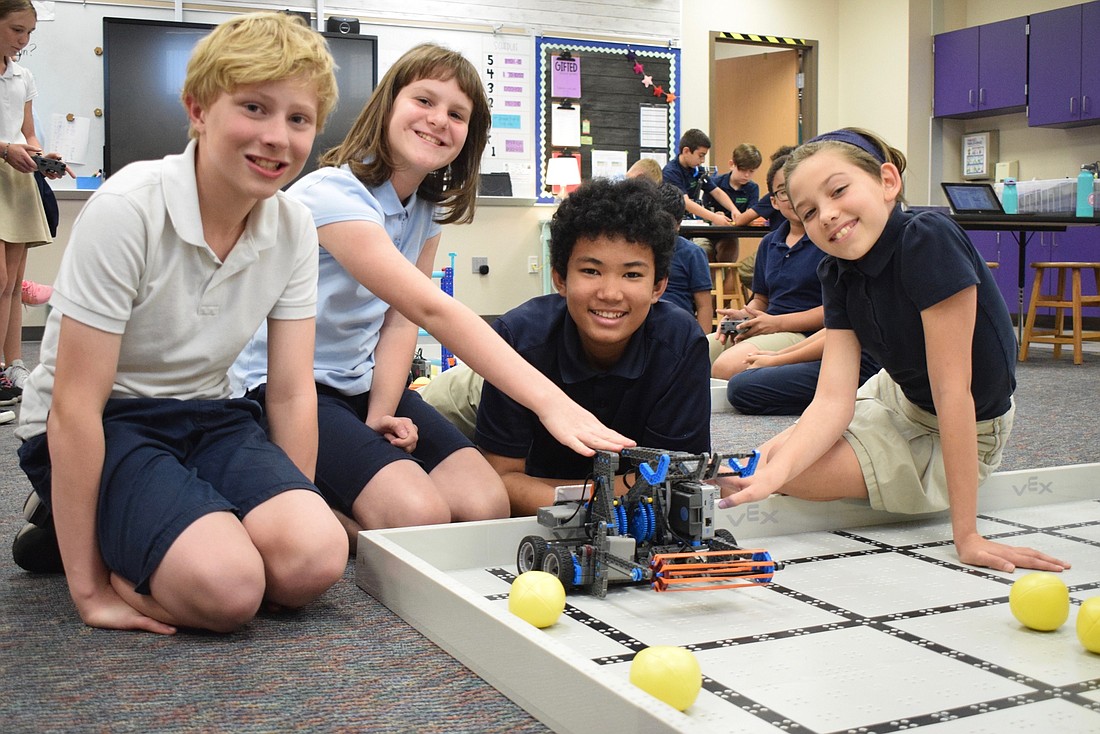 Fifth graders Finley Hendricks, Alisa Sabodash, Noah Johnson and Danica Hall are excited to compete at the VEX Robotics World Competition after placing fourth at the regional competition.