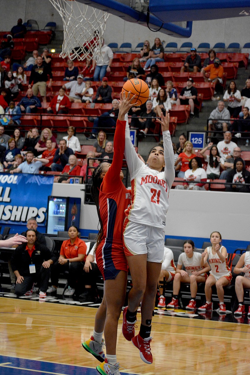Mooney freshman Kali Barrett goes up for a shot against Westminster Academy.