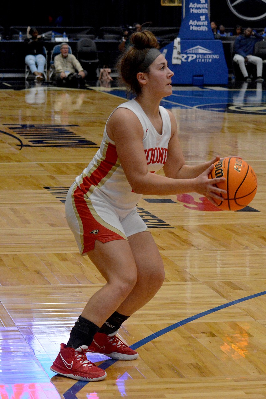 Mooney junior Olivia Davis takes a shot from three-point range.