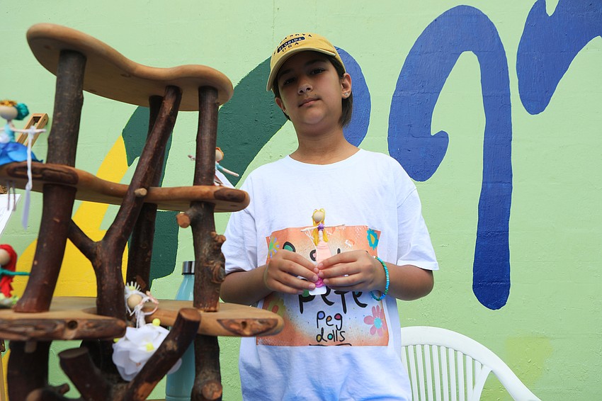 Adela Saladino sells fairy designs and christmas ornaments out of yarn and sticks.