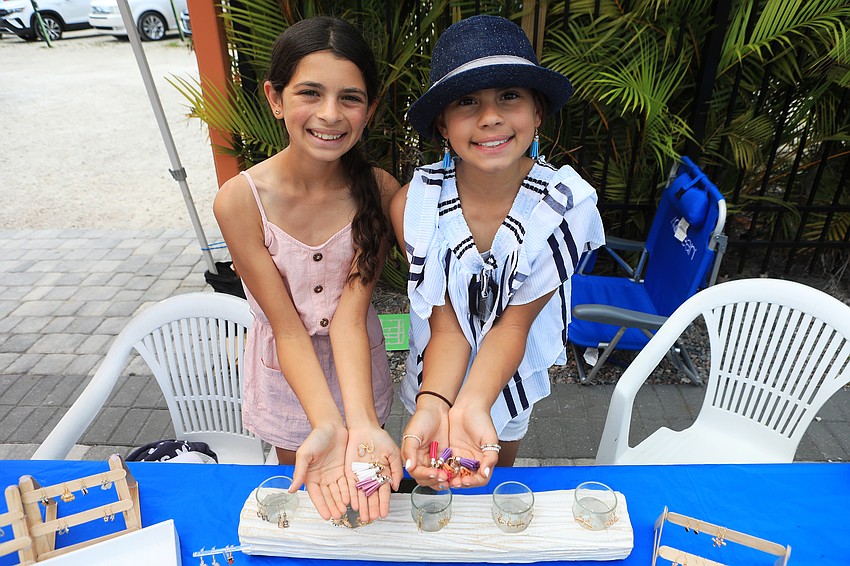 Ashley and Brianna Aular make craft jewelry.