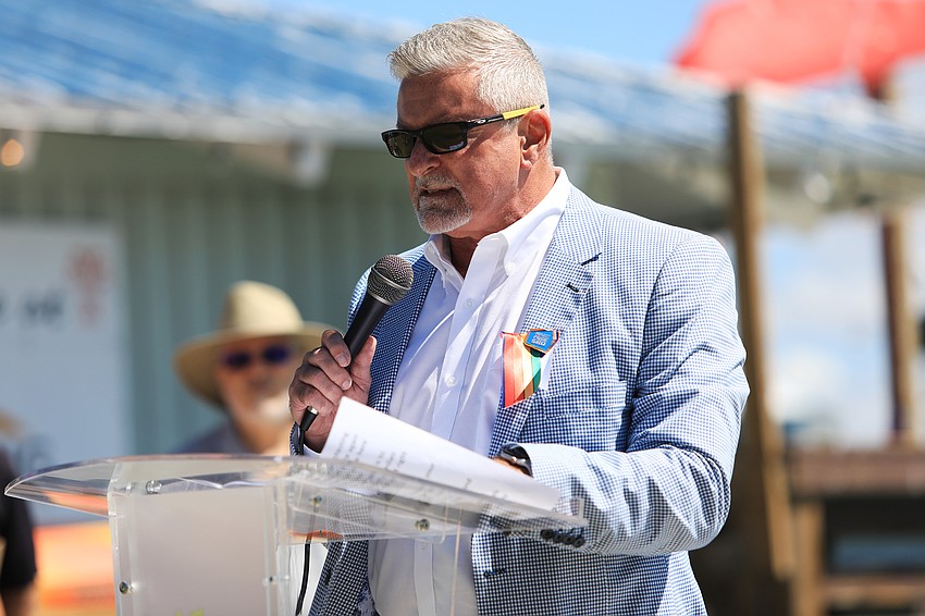 Sarasota school board member Tom Edwards speaks to the audience.