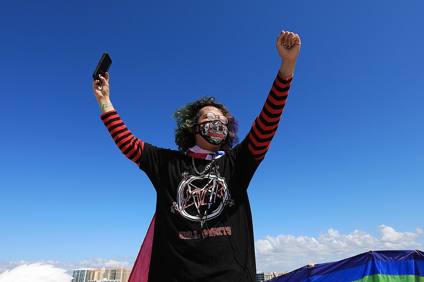 Sherwood MacDonald shouts to oncoming cars.