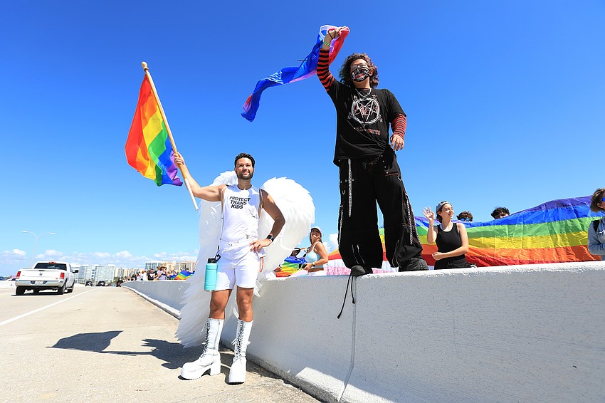 Matthew Ragas and Sherwood MacDonald protest together.