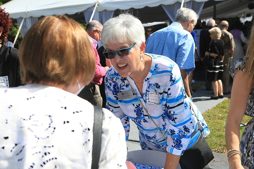 Co-chairwoman Gloria Weed welcomes guests.