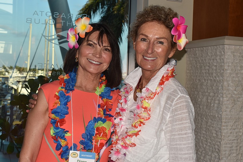 Diane Kaslow and Josette Carter passed out nametags and leis.