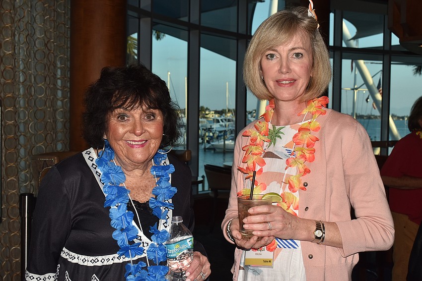 Anne Daley and Jacqui Ritchie matched their leis to their outfits.