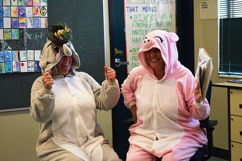 First grade teacher Cristie Keen and second grade teacher Karen Washington dress as an elephant and pig while reading an 