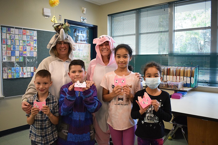 First grade teacher Cristie Keen and second grade teacher Karen Washington have fun with first grader Joshua Smith, second grader Calin Cornejo, second grader Sajah Almarhoon and first grader Zahra Almarhoon.