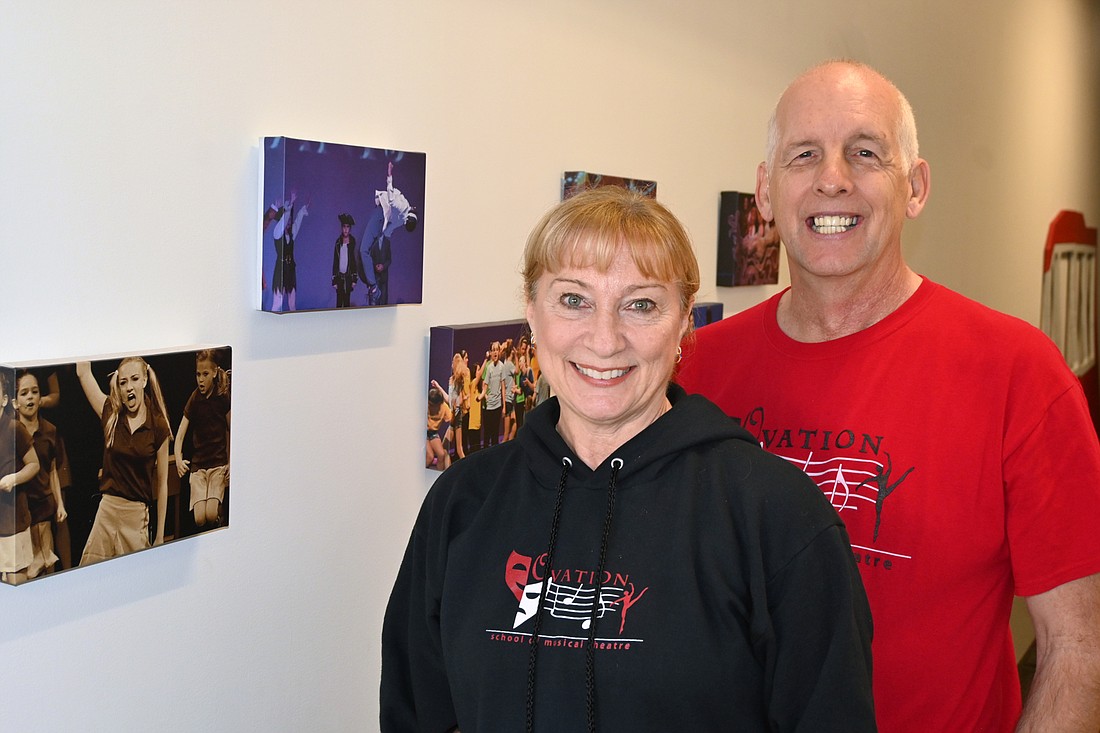 Matt and Michelle McCord smile in front of a picture of Lauren Teyke in the Ovation lobby. (Photo: Spencer Fordin)