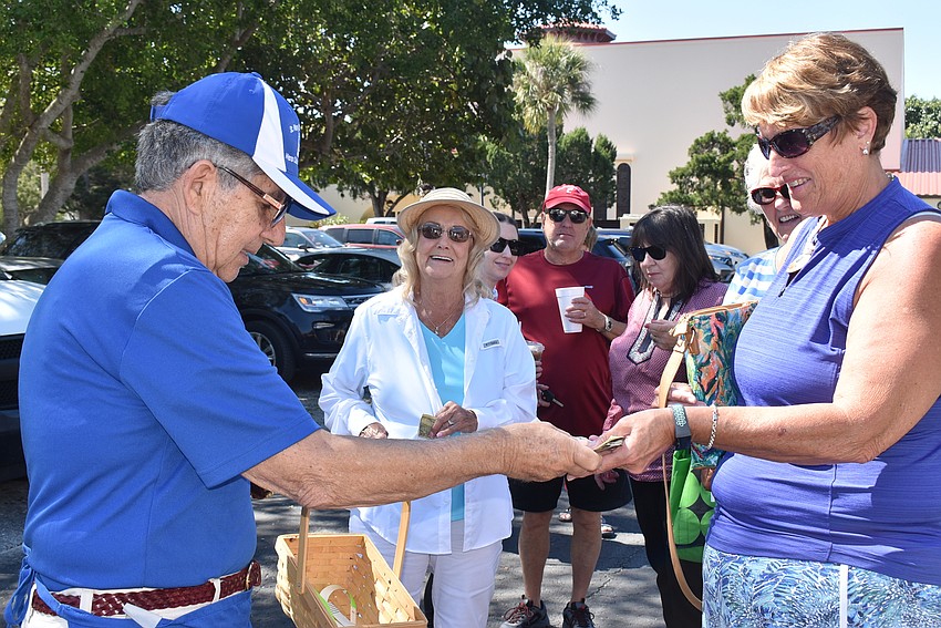 Lenny DiStefano takes admission money from Julie Breen.