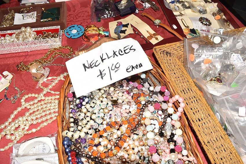 The jewelry table drew a crowd quickly.