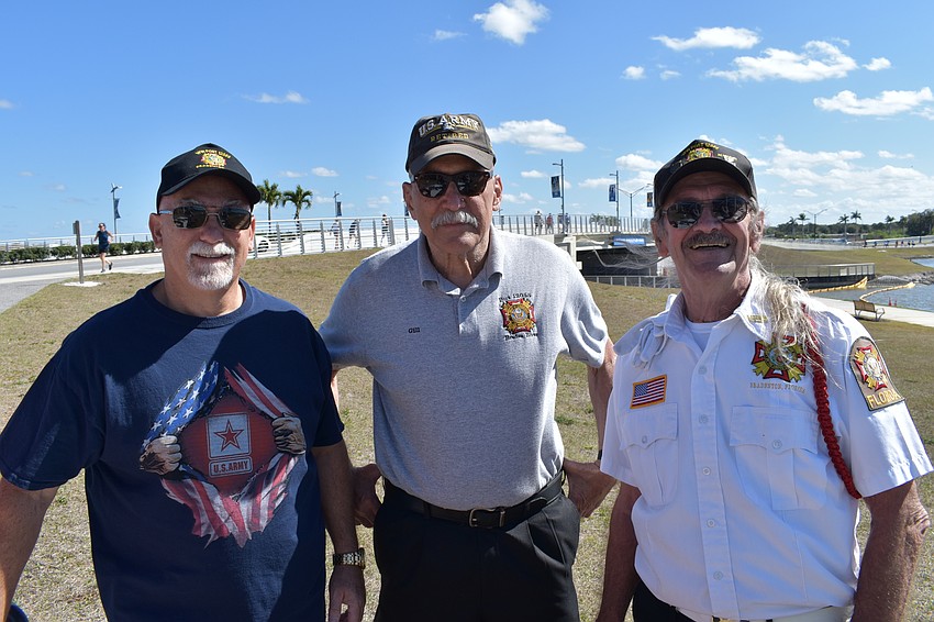 Dave Daily, Gill Ruderman, and Graham Ellis of VFW Braden River Post 12055 offer guests refreshments to support Southeastern Guide Dogs for its services to veterans.