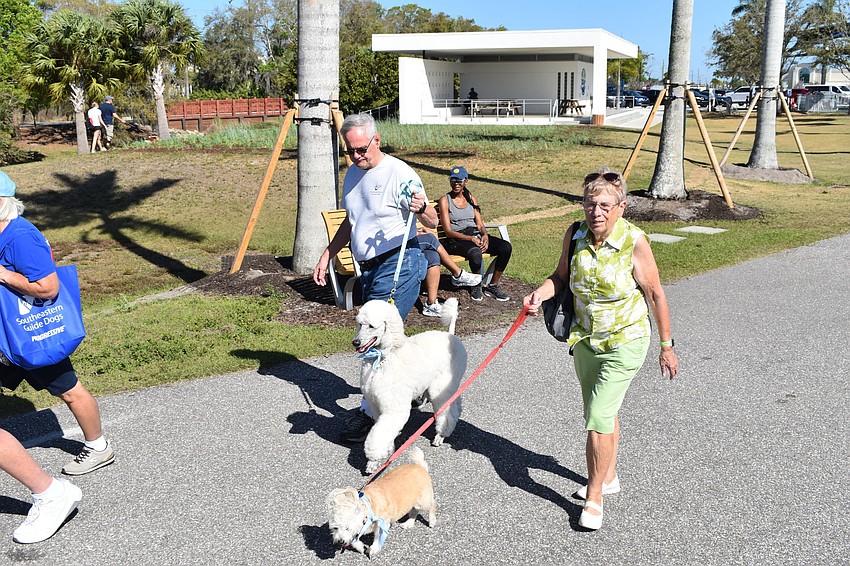 Richard and Lynette Heisler of Sun City Center walk Rumer and Mandy.